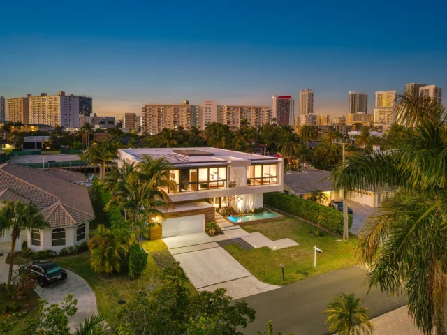 Waterfront Elegance 🌊✨| $6,990,000 
​
Welcome to…418 Sunset Drive, Hallandale Beach, FL 33009📍
​
Located in the guard-gated Golden Isles community, this exceptional 2-story waterfront estate commands 85 ft of prime yacht-friendly water frontage. Boasting 6 bedrooms and 6 bathrooms, the home features soaring 24-ft ceilings throughout the entrance and living areas, creating an open, elegant atmosphere. A private elevator ensures effortless access between levels, while the chef’s kitchen and wine fridge set the stage for sophisticated entertaining. Natural light pours in through the skylight roof, enhancing the home’s airy feel, while the luxury pool and jacuzzi provide a tranquil retreat. With direct access to the bay and ocean, each evening offers a captivating, front-row view of the sunset. Experience the pinnacle of waterfront luxury living in this extraordinary estate. Call today!
​
📍 Hallandale Beach, FL
🛏️ 6 Bedrooms
🛁 6 Bathrooms | 1 Half Bathroom
📐 5,793 Interior SF | 6,902 Total SF
🌊 85 ft of Yacht-Friendly Water Frontage
​
Want More Details?
📲 305.400.9507
📧 Info@TheChadCarrollGroup.com
​
@chadcarroll | @thecarrollgroup | @compassfl