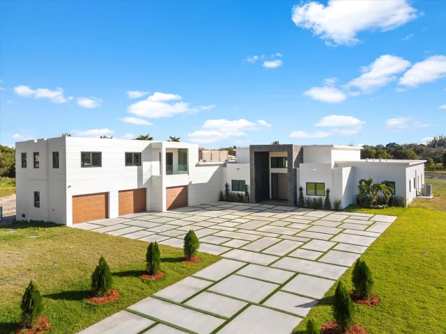 9,000 Sq. Ft. of New Luxury Living in Southwest Ranches✨| Offered at: $6,999,995
​
Welcome to… 17301 SW 52nd Ct, Southwest Ranches, FL 33331📍
​
Welcome to your private sanctuary in the coveted Southwest Ranches, where this brand-new, 9,000 sq. ft. modern mansion—expandable to over 10,000 sq. ft.—stands as a breathtaking testament to architectural brilliance. Crafted with the finest materials and an unwavering attention to detail, it boasts an ideal floor plan featuring soaring ceilings and expansive, light-filled rooms. Set on 2.1 lush acres, the estate offers 6 luxurious bedrooms, a chef’s kitchen, a serene sauna, a fully equipped exterior gym, a 3-car garage, and a sophisticated entertainment room. The stunning pool terrace is a masterpiece, complete with fire pits, a built-in bar, an outdoor kitchen, a bathroom, and a cold plunge.
​
​
📍| Southwest Ranches, FL
🛏️| 6 Bedrooms
🛁| 7 Bathrooms
📐| 8,846 Square Feet
​
Want More Details?
📲| 305.400.9507
✉️| Info@TheChadCarrollGroup.Com
​
@chadcarroll | @thecarrollgroup | @compassfl